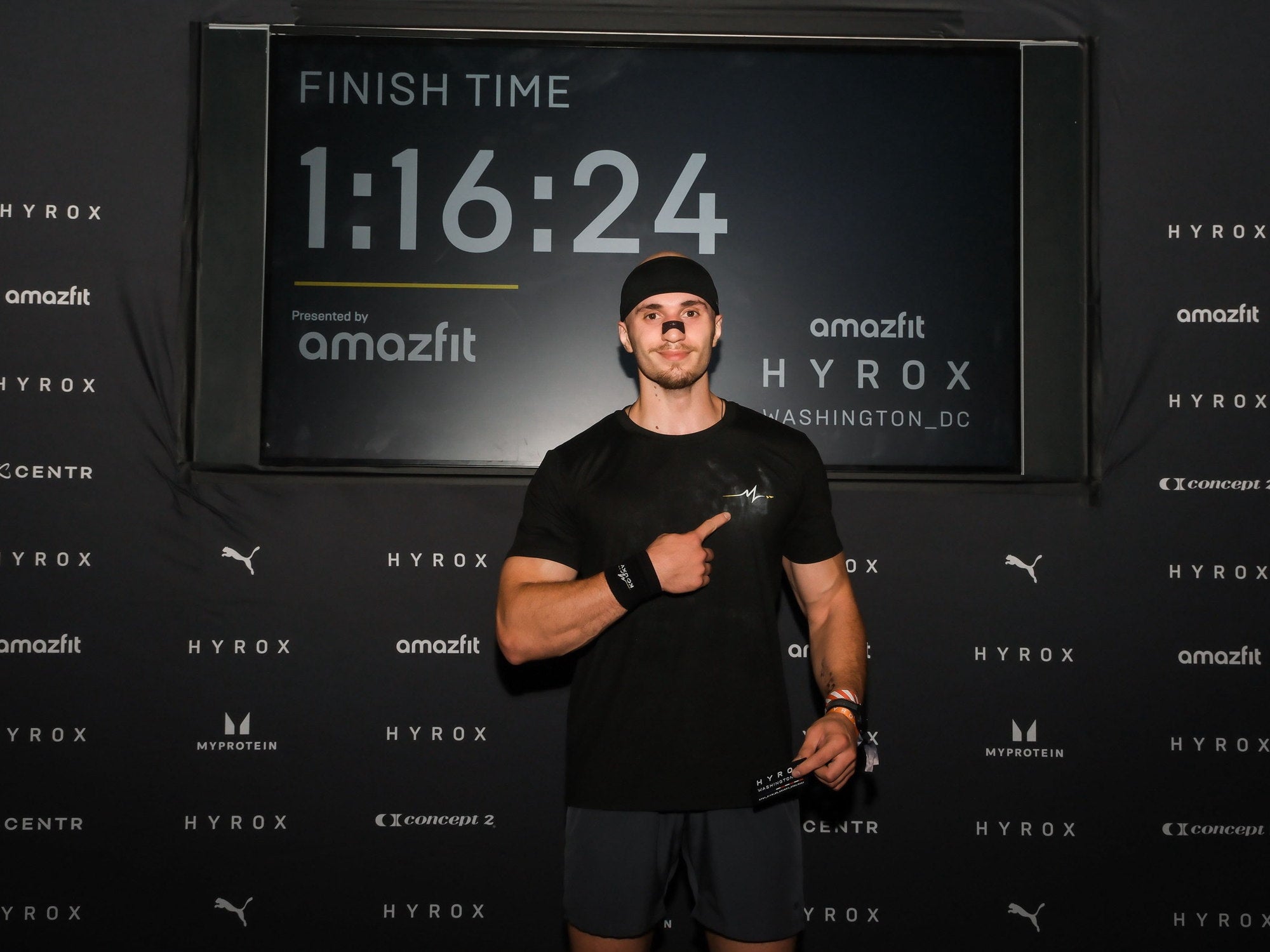 KOUXY founder at the HYROX Washington DC finish board showing a 1:16:24 finish time