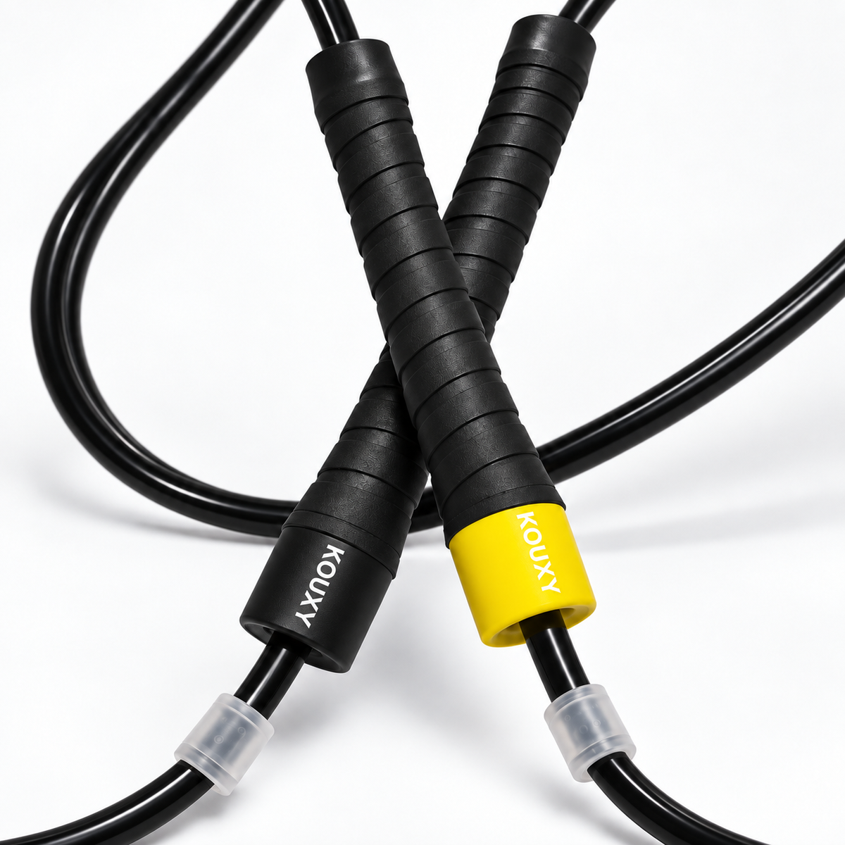 KOUXY Speed Rope — close-up of textured grip handles with yellow KOUXY cap